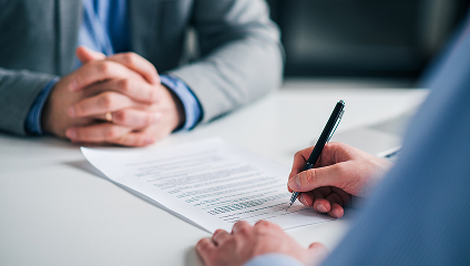 business man signing documents