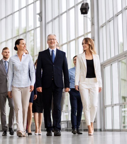 a business team walking down a building